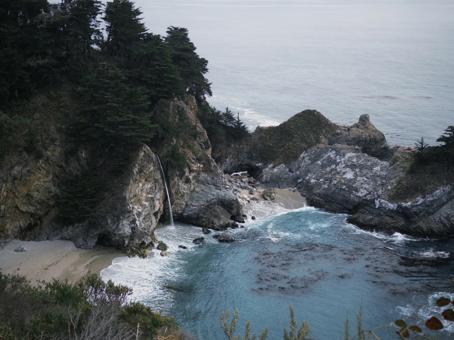 A waterfall falling onto the beach