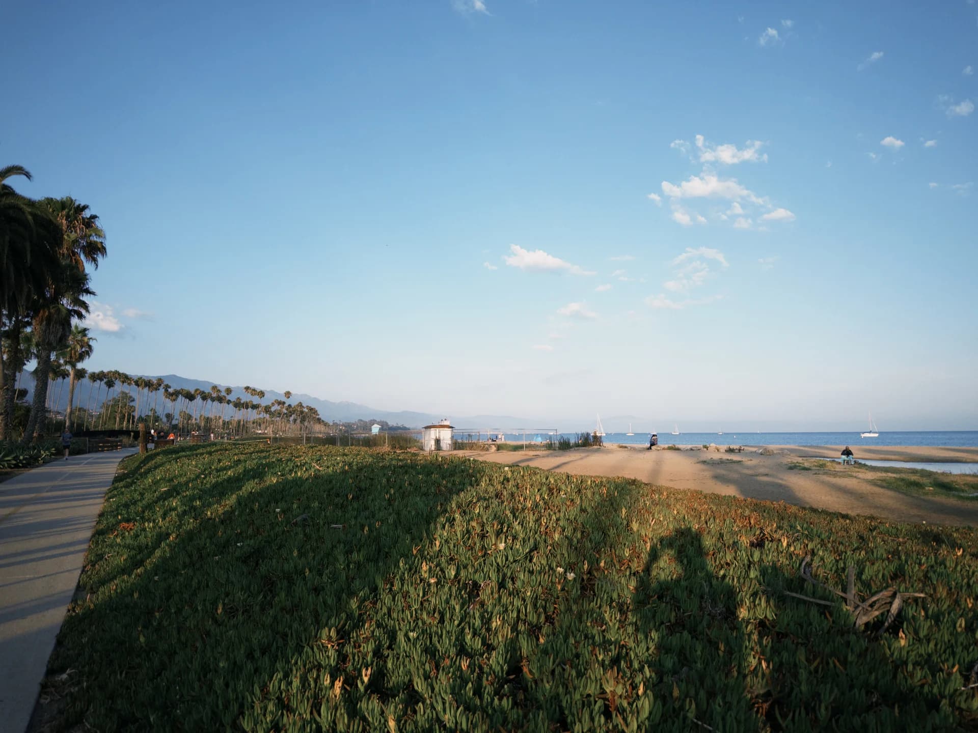 A walk along the palm-lined beachfront