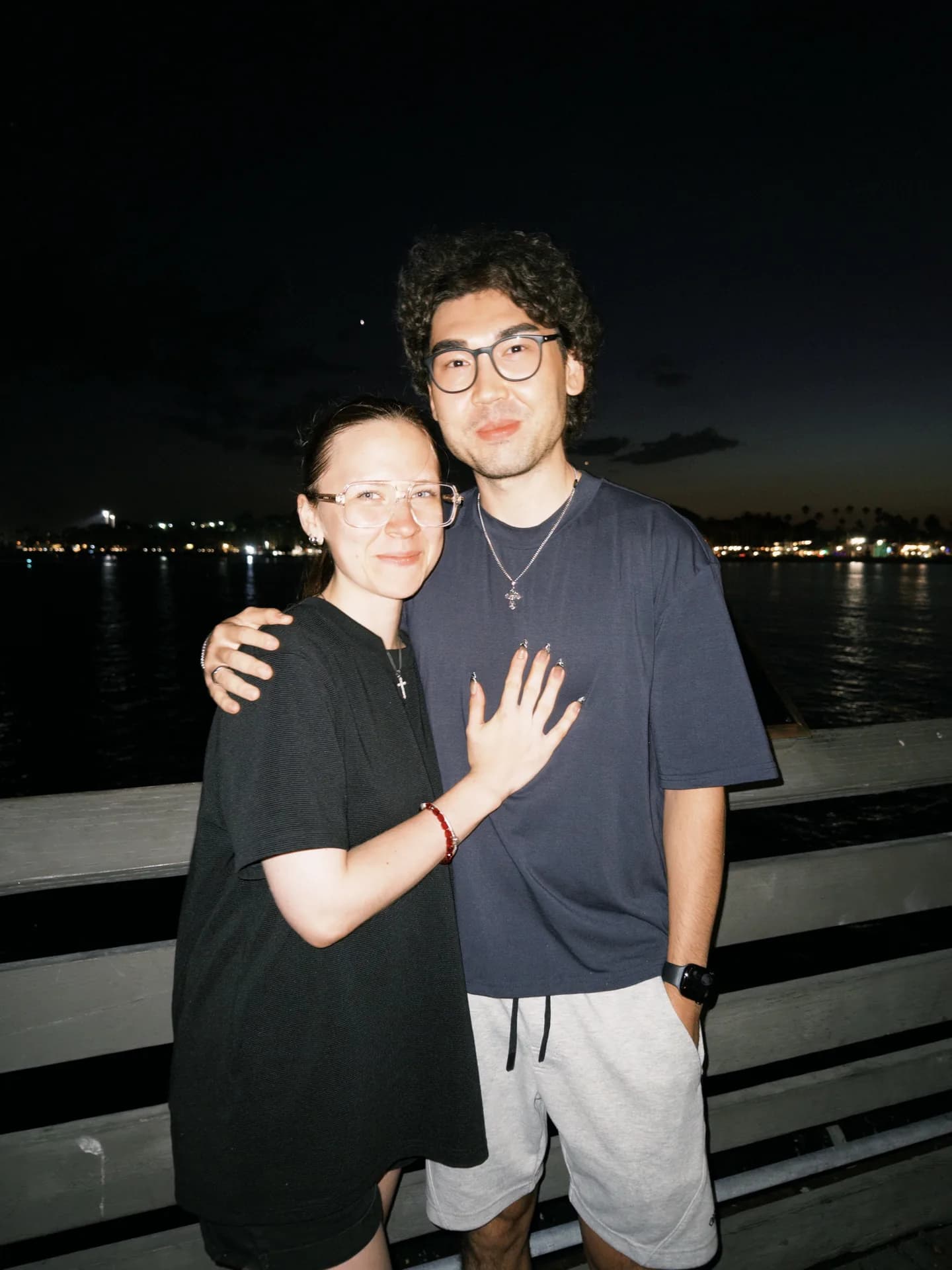 My girlfriend and me on the pier at night