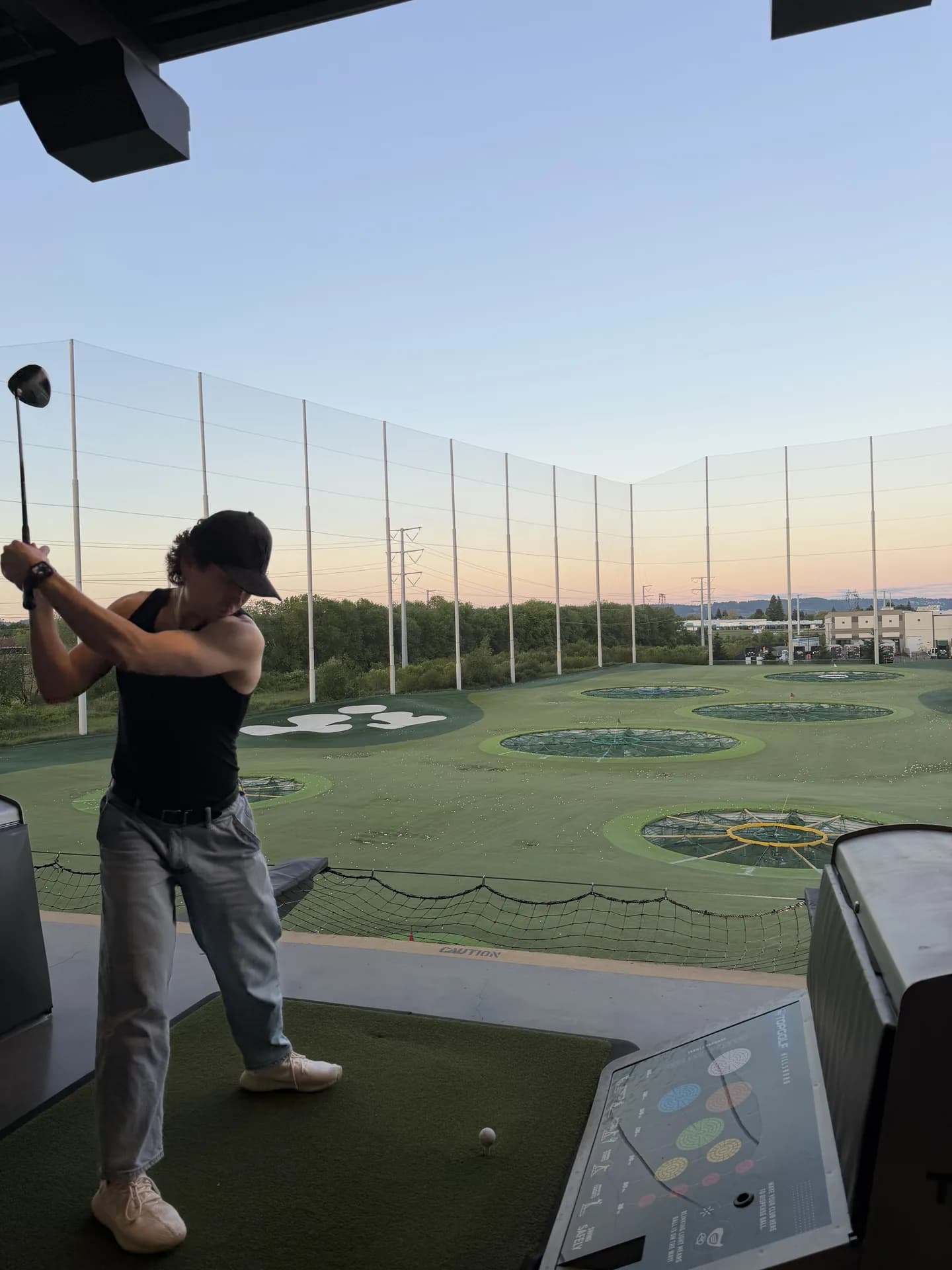 Mid-swing at Topgolf
